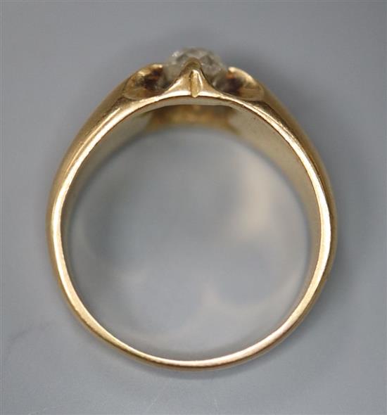 An early 20th century yellow metal and claw set solitaire diamond ring, size N, gross 7.1 grams,
